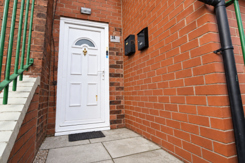 Tidy Brick Entrance with White Door