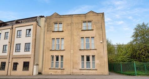 Charming stone exterior with large windows...