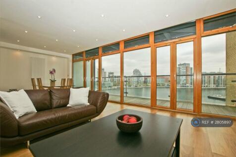Living Room And Dining Room With Dock Views