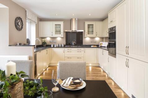 Open-plan kitchen with family and dining areas