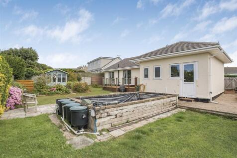 OUTSIDE TO THE REAR OF THE PROPERTY