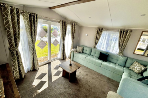 Spacious Living Area with Patio Doors in the Wille