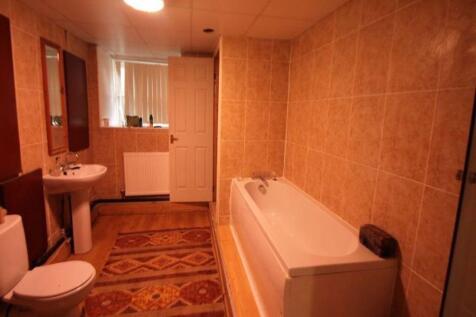 A spacious bathroom suite featuring a full bath...