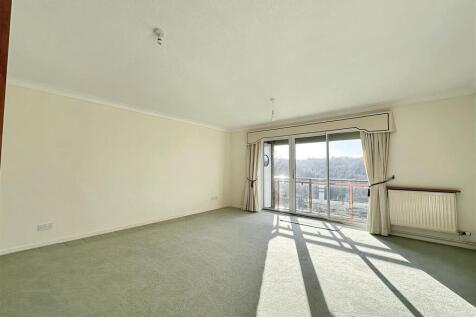 Spacious bright lounge with large balcony doors...