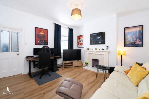 Modern living room with gaming setup.png