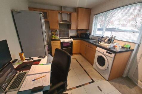 Bright fitted kitchen with plentiful worktops, ...