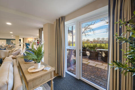 a living room with a large glass door