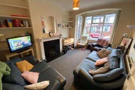 Bright, well-furnished living room with comfort...