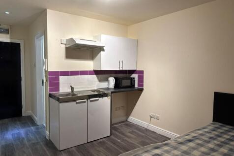 A compact but functional kitchen featuring a sm...