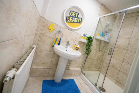 Modern bathroom with walk-in shower and basin...