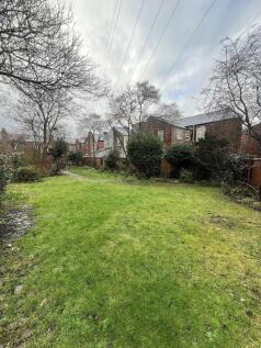 Expansive lush green lawn for outdoor socialisi...