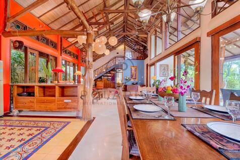 Spacious open-concept dining and living area with 