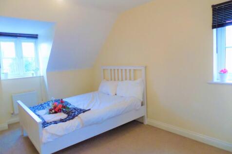 Bright and cozy double bedroom featuring a comf...