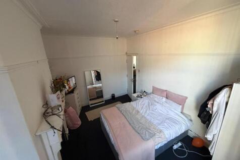 Bright and airy bedroom with comfortable bed...