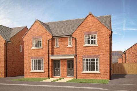 A pair of modern brick semi-detached houses with grey doors and white-framed windows stand on a pave
