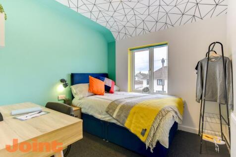Bright, modern bedroom with a comfortable doubl...