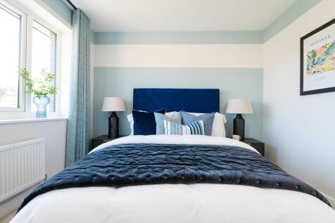 There's space for a king-size bed and ample storage in the main bedroom