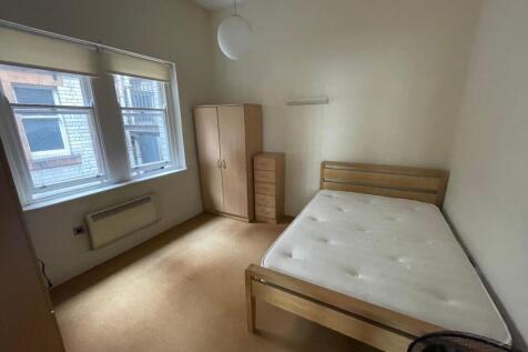 Bright double bedroom with ample storage space...