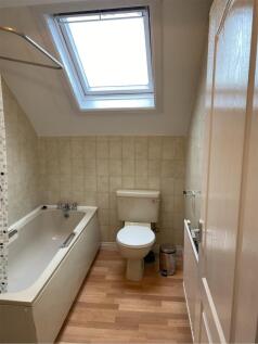 A tidy and well-maintained bathroom featuring a...