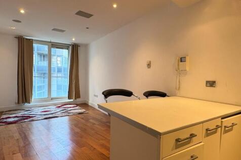 Modern living space with floor-to-ceiling windo...