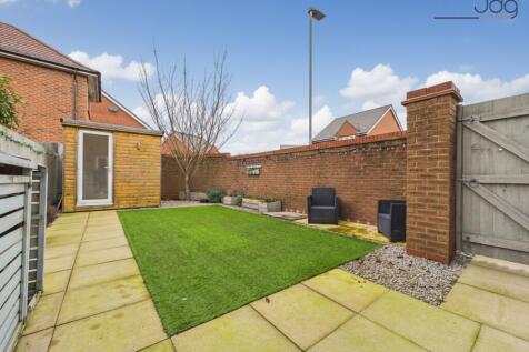 South facing private garden with astro turf and patio seating