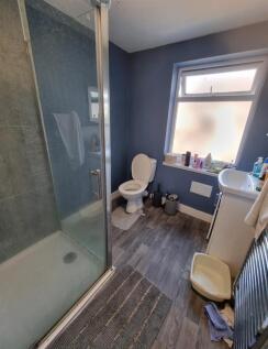 Modern bathroom with large walk-in shower...