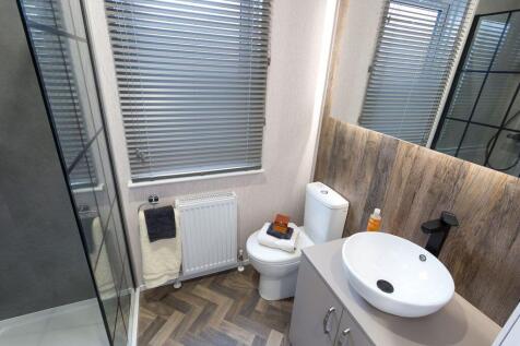 Modern Shower Room With Wood Effect Feature Wall