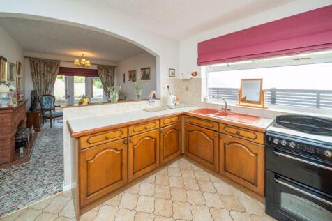 KITCHEN OPENS TO DINING ROOM