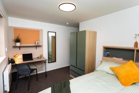 Bright modern bedroom with stylish study desk...