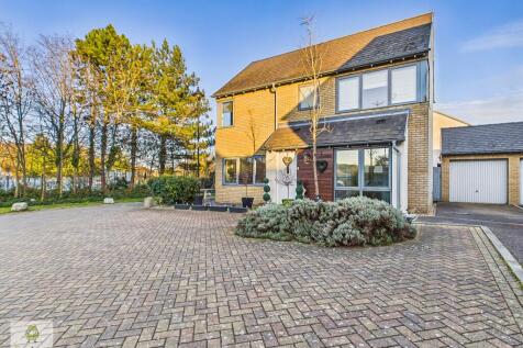 View Of Property With Drive And Garage