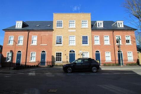 Stunning modern facade under a clear blue sky...