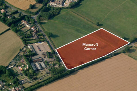 Land opposite commercial property.