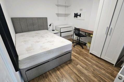 Bright, modern bedroom with a comfortable doubl...
