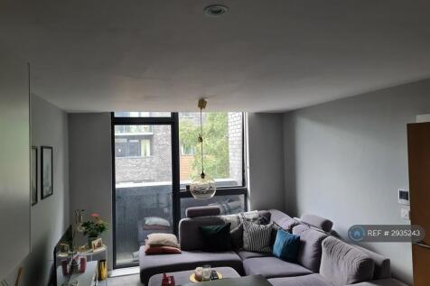 Living Room With Patio Door To Balcony