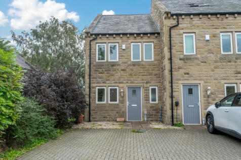 A CHARMING THREE-BEDROOM END-TERRACED HOME WITH A