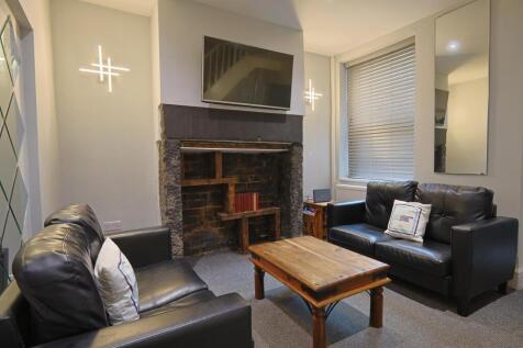 Living room with fireplace and TV