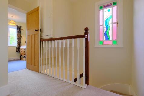 Sun-filled landing leading to 3 bedrooms