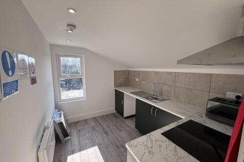 Bright, modern kitchen with fitted units, integ...