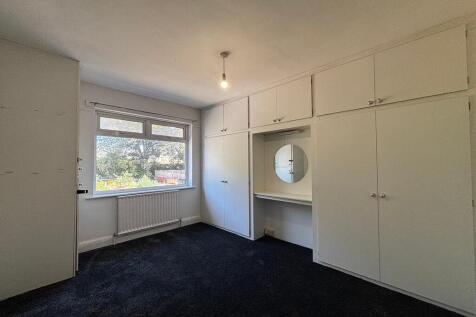 Spacious bedroom with ample built-in storage...