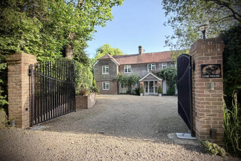 Front elevation, censored automated double gates and private parking for numerous vehicles