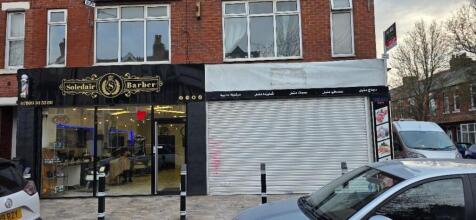 Shopfront with modern barber and parking...
