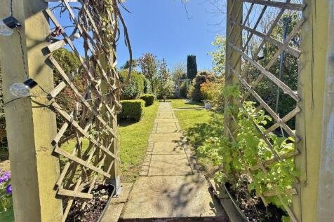 From the patio up the garden