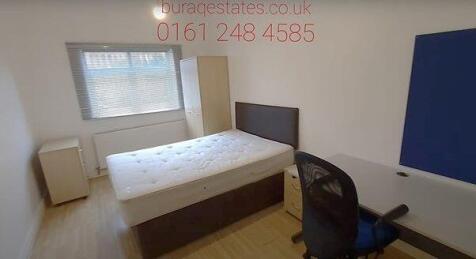 Bright bedroom with study desk and double bed...