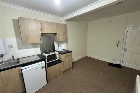 Bright kitchen with ample workspace and storage...