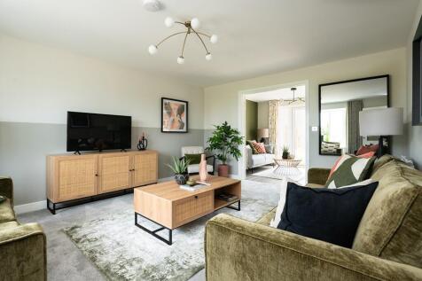 A welcoming &amp; cosy living area with connecting doors to the kitchen