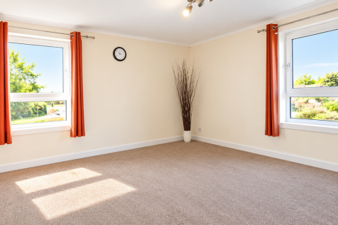 Bright Neutral Living Room with Orange Curtains