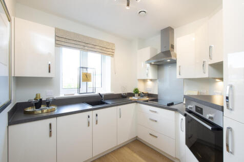 a kitchen with white cabinets