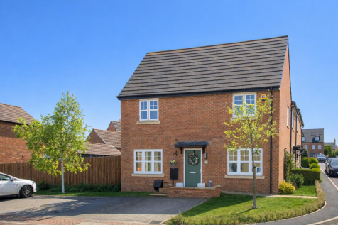Sunny suburban house with green door.png