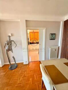 Bright and cozy living space with a decorative scu