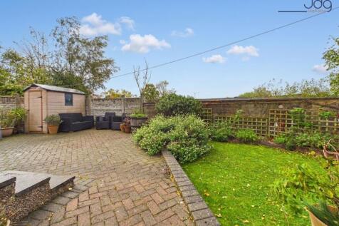 A Generous Wraparound Garden with Established Planting